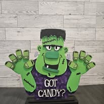 Layered green Frankenstein decoration holding a Got Candy sign